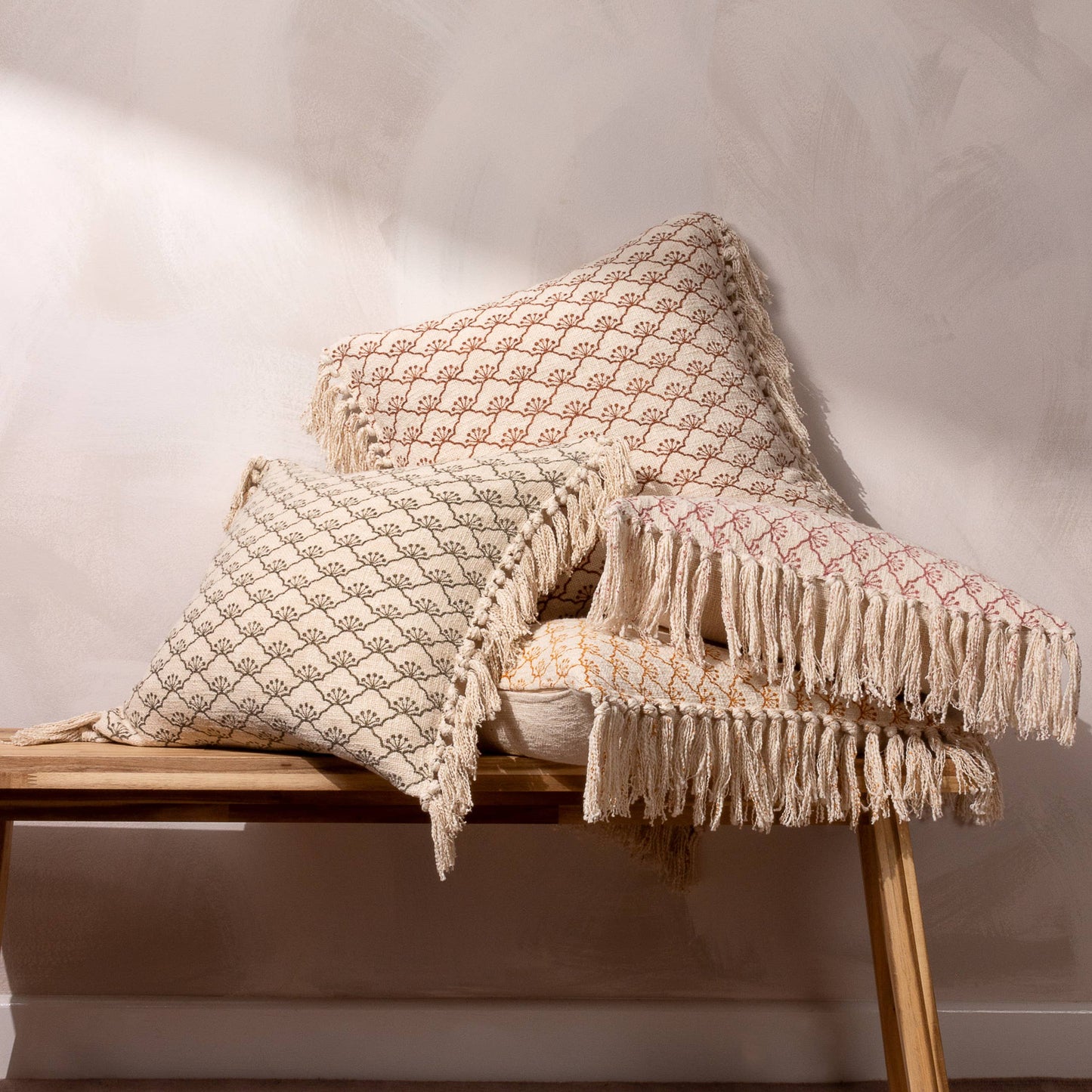 Boho tassel cushion in ecru and mastard